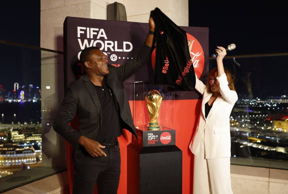 Marcel Desailly unveils the World Cup trophy during the Trophy Tour at the Alwadi Hotel in Doha November 13, 2022. — Reuters pic