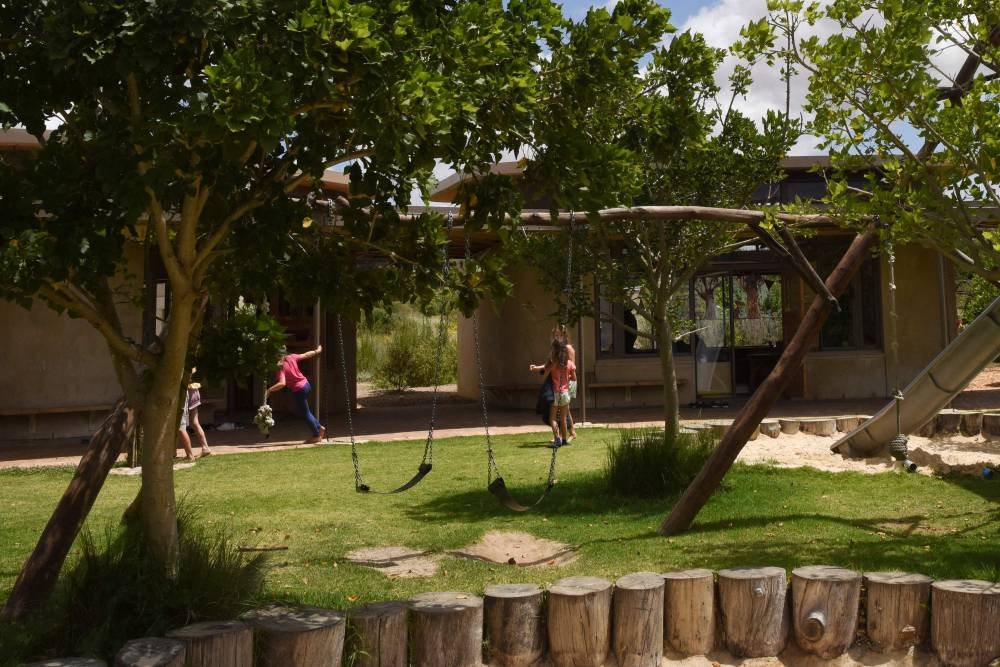Children play outside at the Green School South Africa campus, located close to Paarl, about 60km from Cape Town, on November 7, 2022. — AFP pic