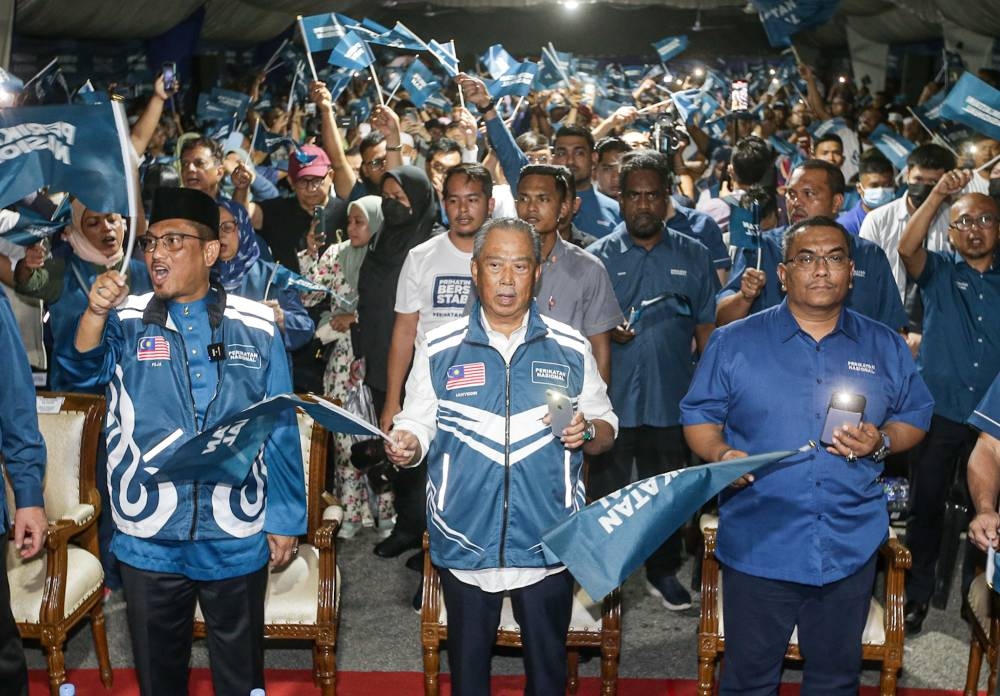 Muhyiddin (centre) said he had once advised Anwar that he would never get support from the country’s Malay majority demographic group for as long as he remained friends with the DAP. — Picture by Farhan Najib