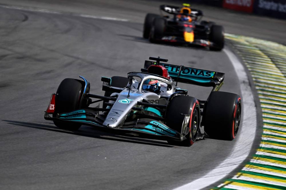 Mercedes’ British driver George Russell is chased by Red Bull Racing’s Mexican driver Sergio Perez races during the Formula One Brazil Grand Prix at the Autodromo Jose Carlos Pace racetrack, also known as Interlagos, in Sao Paulo, Brazil, November 13, 2022. — AFP pic 