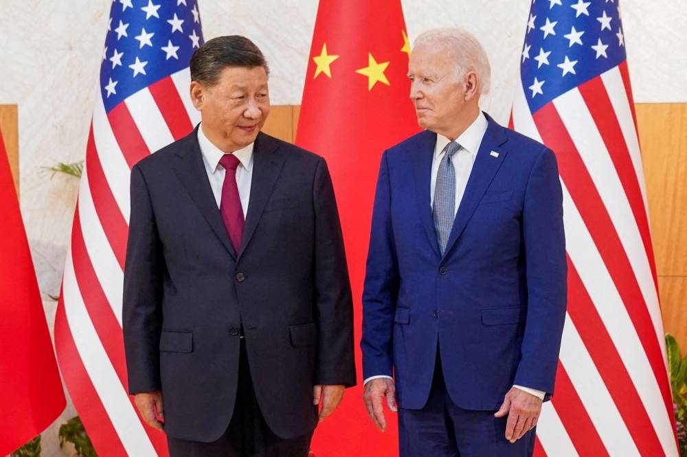 Chinese President Xi Jinping (left) meets US President Joe Biden on the sidelines of the G20 leaders' summit in Bali, Indonesia November 14, 2022. — Reuters pic 