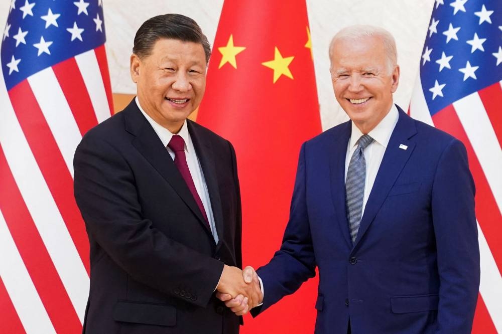 US President Joe Biden shakes hands with Chinese President Xi Jinping as they meet on the sidelines of the G20 leaders’ summit in Bali November 14, 2022. — Reuters pic