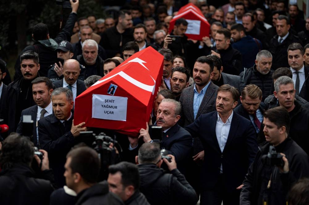 People carry coffins of victims during funeral ceremonies of people who lost their lives after the explosion on Istiklal Street, in Istanbul November 14, 2022.  — AFP pic