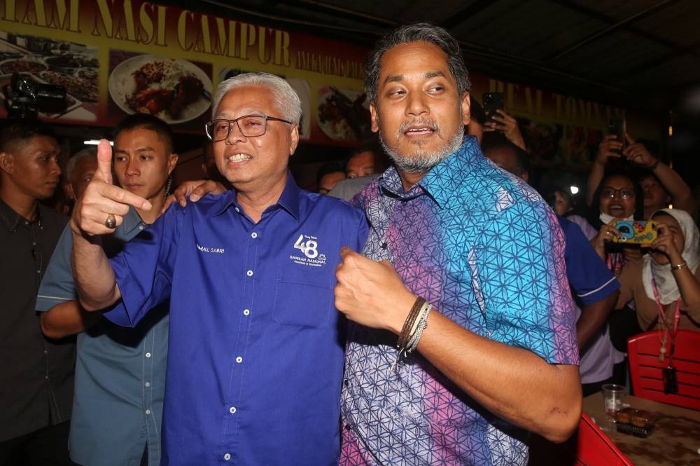 Datuk Seri Ismail Sabri Yaakob and Khairy Jamaluddin, Barisan Nasional's Sungai Buloh candidate for GE15, are pictured while campaigning in Kota Damansara November 14, 2022. — Picture by Choo Choy May