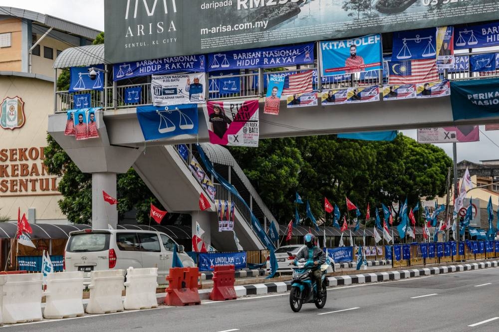 Party flags and banners adorn a road in Sentul on November 11, 2022. Picture by Firdaus Latif