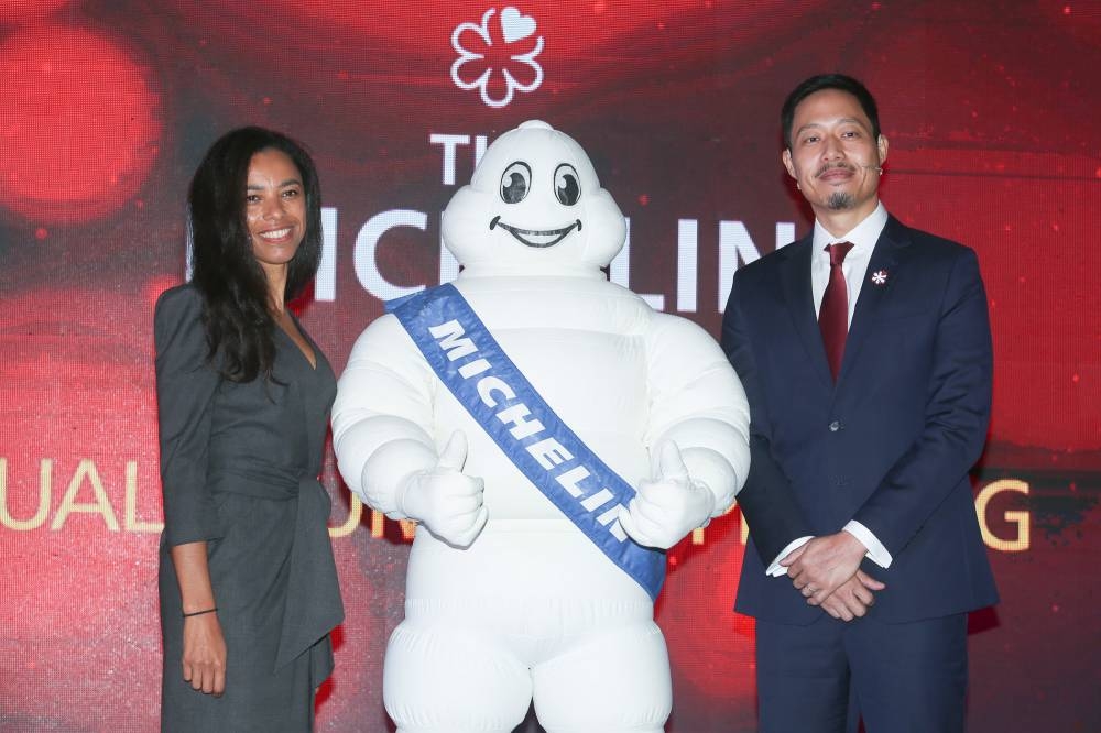 Michelin Experiences director of communications Elisabeth Boucher-Anselin and MANAGING DIRECTOR of Michelin Malaysia, Singapore & Brunei Prichapakorn Dangrojana at the launch of the inaugural Michelin Guide for Kuala Lumpur & Penang. — Picture by Choo Choy May 