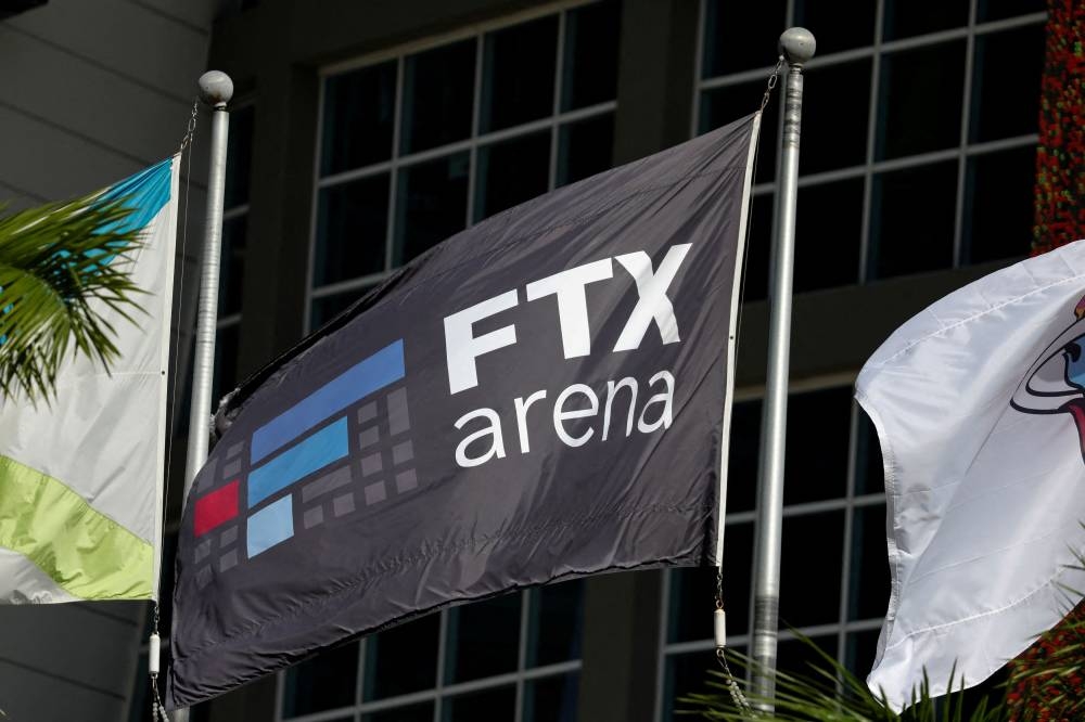 The logo of FTX is seen on a flag at the entrance of the FTX Arena in Miami, Florida November 12, 2022. — Reuters pic