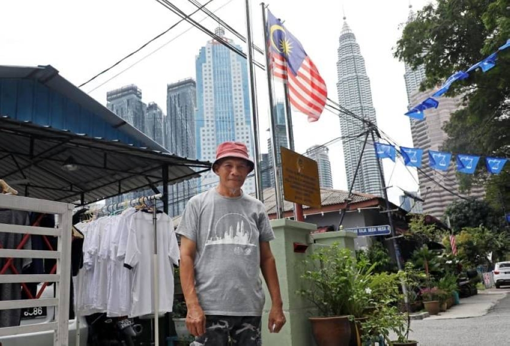 Adam Mohd Sahat is pictured outside his house in Kampung Baru November 13, 2022. — Picture via TODAY