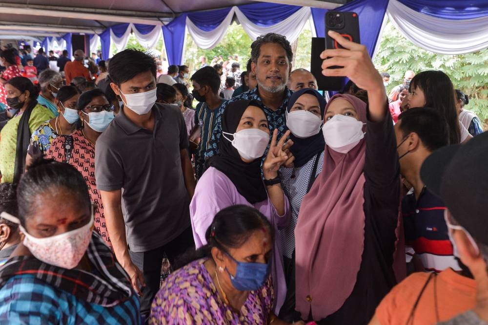 Barisan Nasional candidate for Sungai Buloh, Khairy Jamaluddin greeting supporters in Bandar Baru Sg Buloh November 13, 2022. — Picture by Miera Zulyana
