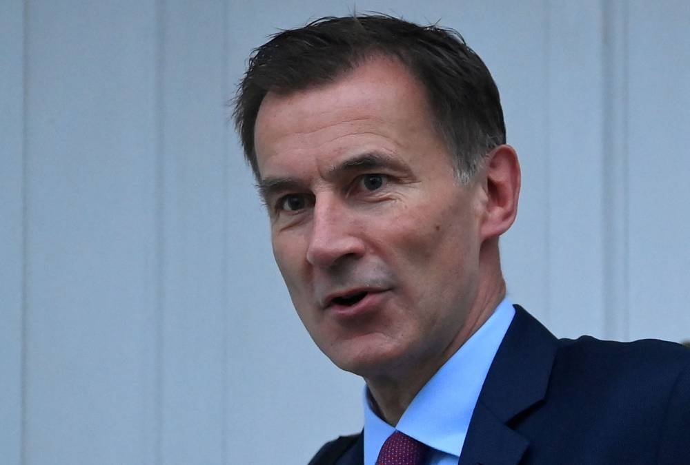 Finance minister Jeremy Hunt has warned of more pain in his budget statement that will represent an abrupt reversal of policy from the unfunded tax cuts promised by former Prime Minister Liz Truss less than two months ago. ― Reuters pic