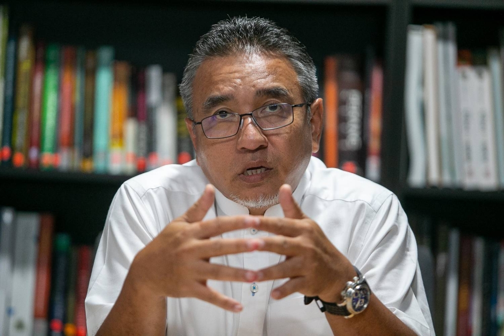 Melaka Pakatan Harapan chairman Adly Zahari speaks to Malay Mail during an interview in Ayer Keroh November 11, 2022. — Picture by Raymond Manuel