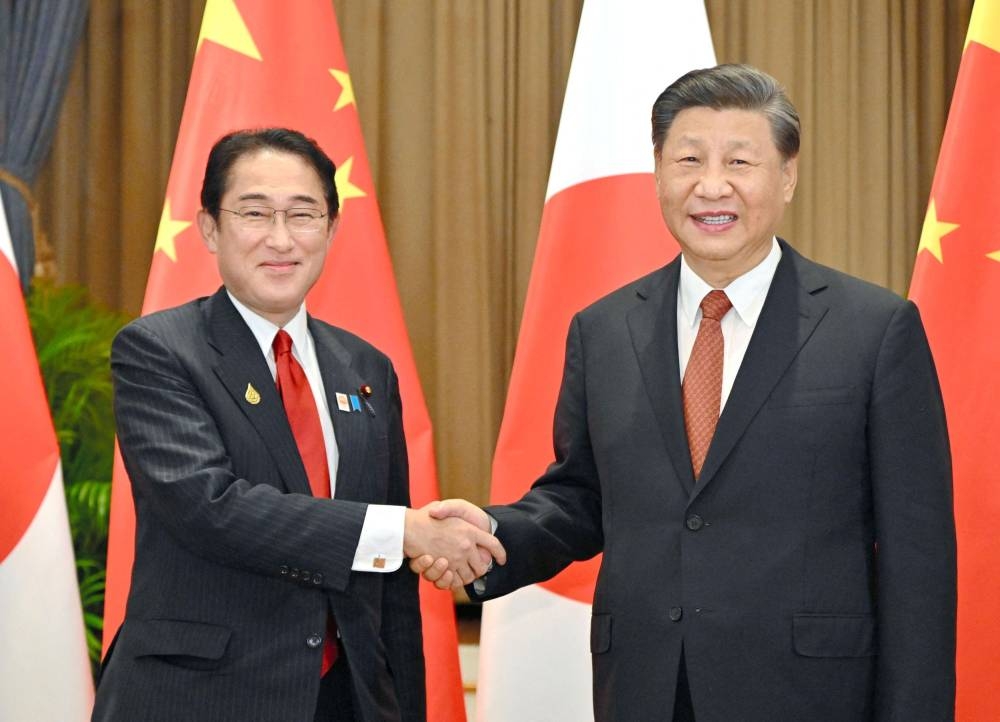 Japanese Prime Minister Fumio Kishida meets Chinese President Xi Jinping on the sidelines of the Asia-Pacific Economic Cooperation (Apec) Summit in Bangkok, Thailand November 17, 2022, in this photo released by Kyodo. ― Kyodo via Reuters