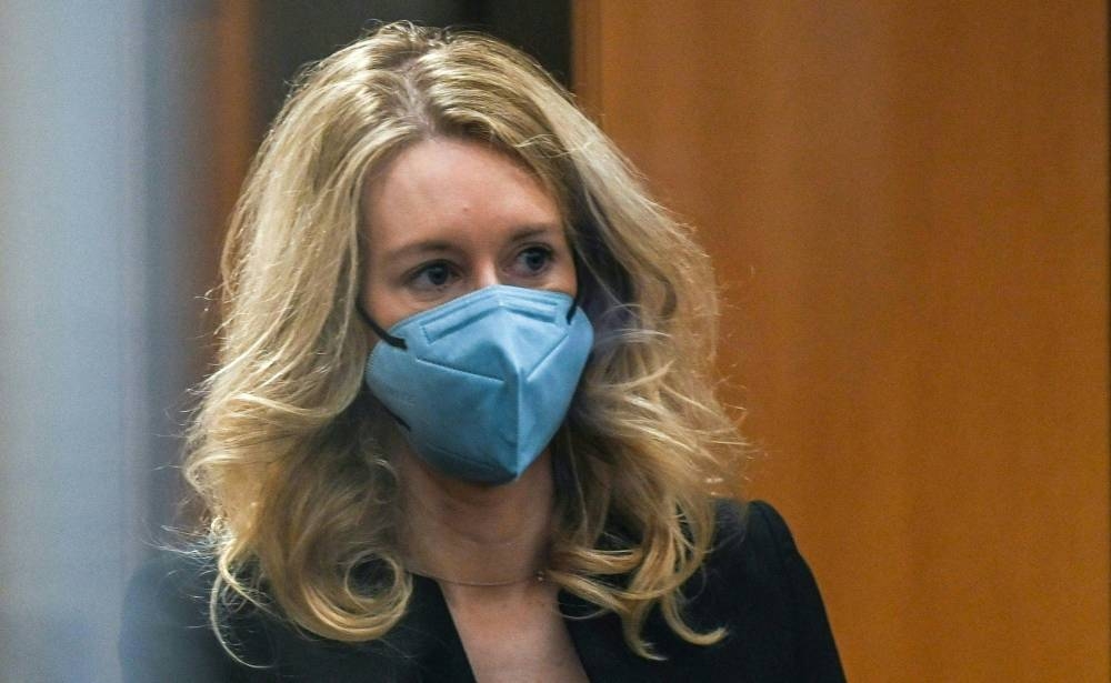 In this file photo taken on November 22, 2021, former Theranos founder and CEO Elizabeth Holmes goes through security after arriving for court at the Robert F. Peckham Federal Building in San Jose, California. ― AFP pic