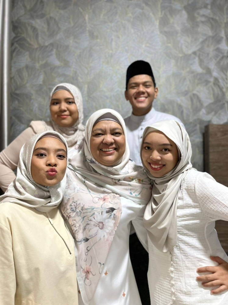 Nor Laili Mohamed and her four children. — Picture courtesy of Nor Laili Mohamed