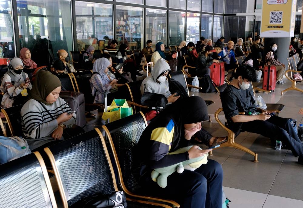 Passengers returning to their hometowns for polling day are seen in a waiting room before being allowed to board the bus to their respective destinations, at the Kuantan Central Terminal (TSK), November 18, 2022. — Bernama pic