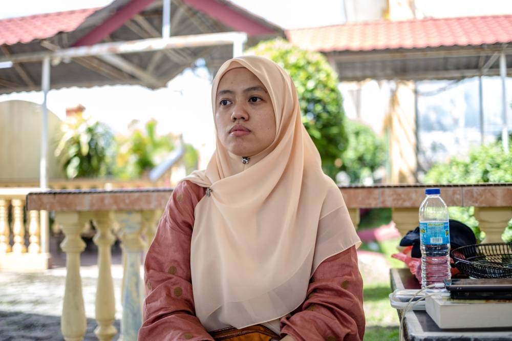 Aisha Adam who has voted in the Setiawangsa parliamentary seat in the past two general elections, claimed an EC officer told her she cannot cast her ballot as she had been registered as a postal voter. ― Picture by Firdaus Latif