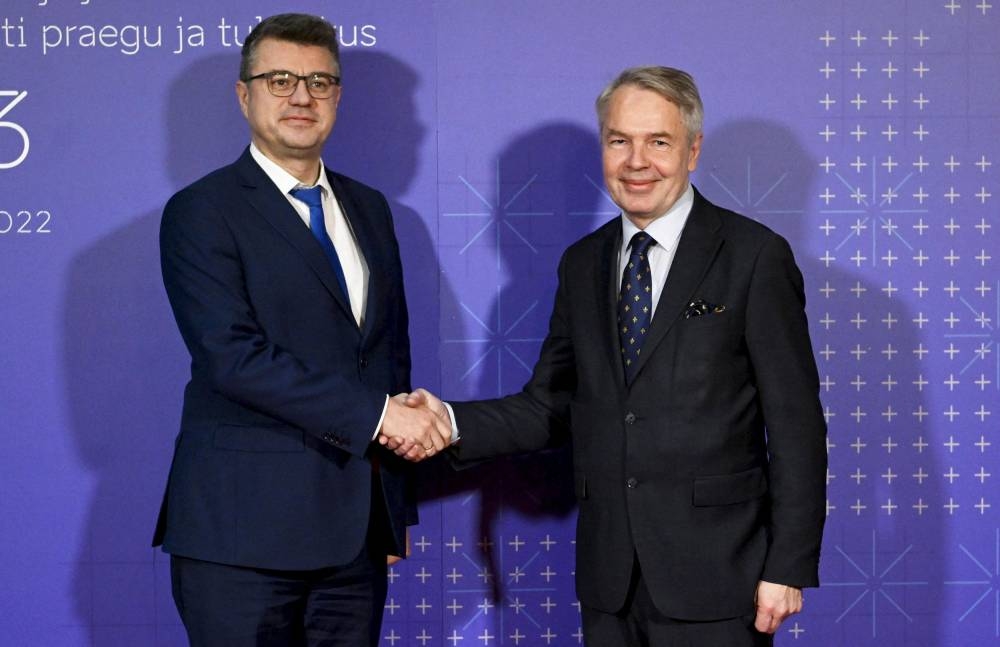 File photo of Finnish Foreign Minister Pekka Haavisto and his Estonian counterpart Urmas Reinsalu shaking hands at the House of the Estates in Helsinki, Finland, on November 15, 2022. — Reuters pic