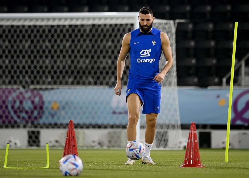 France's forward Karim Benzema takes part in a training session at the Jassim-bin-Hamad Stadium in Doha, ahead of the Qatar 2022 World Cup football tournament. — AFP pic