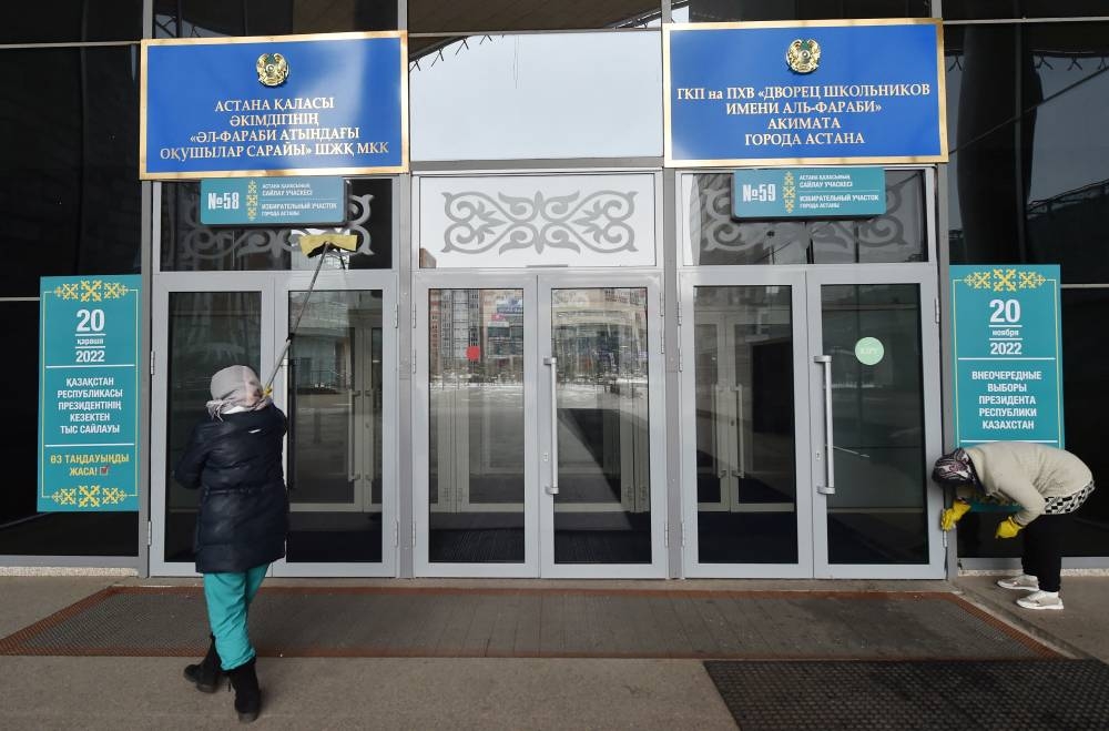 Workers prepare a polling station in Astana on November 19, 2022, ahead of Kazakhstan's presidential elections on November 20. — AFP pic
