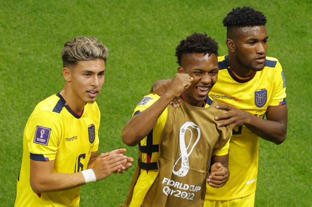 Ecuador's midfielder #16 Jeremy Sarmiento celebrates with teammates at the end of the Qatar 2022 World Cup Group A football match between Qatar and Ecuador at the Al-Bayt Stadium in Al Khor, north of Doha on November 20, 2022. — AFP pic