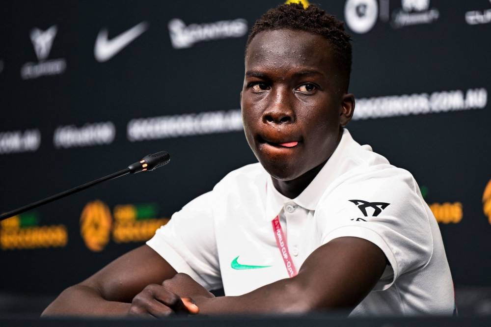 Australia's Garang Kuol attends a press conference at the Aspire Academy in Doha on November 18, 2022, ahead of the Qatar 2022 World Cup football tournament. — AFP pic