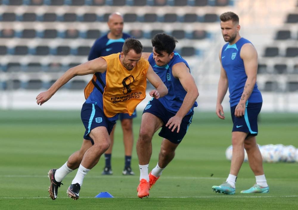 England’s Harry Kane and Harry Maguire during training at Al Wakrah SC stadium, Al Wakrah, Qatar, November 20, 2022. — AFP pic  