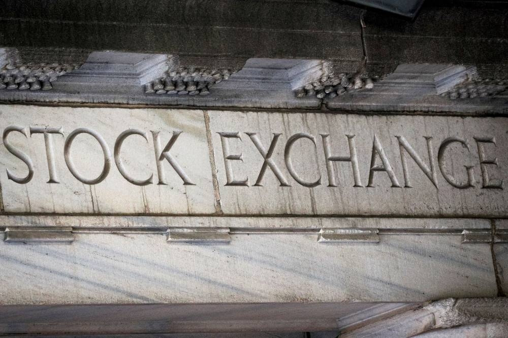 ‘Stock Exchange’ is seen over an entrance to the New York Stock Exchange (NYSE) on Wall Street in New York City March 29, 2021. — Reuters pic