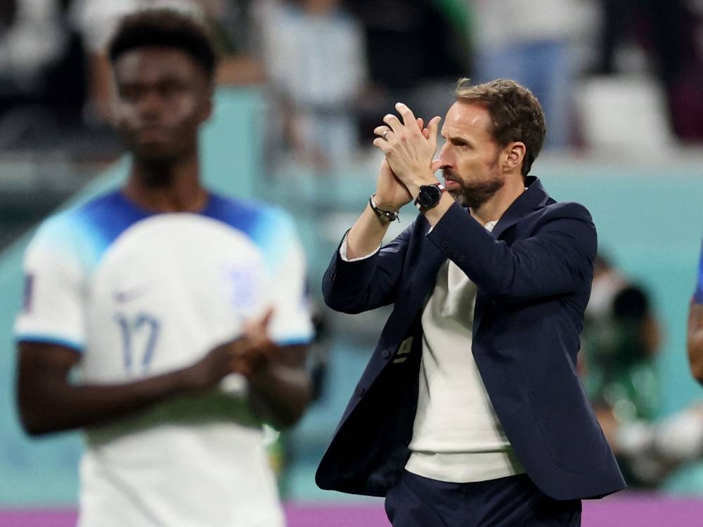 England manager Gareth Southgate applauds fans after the match against Iran at the Khalifa International Stadium, Doha November 21, 2022. — Reuters pic