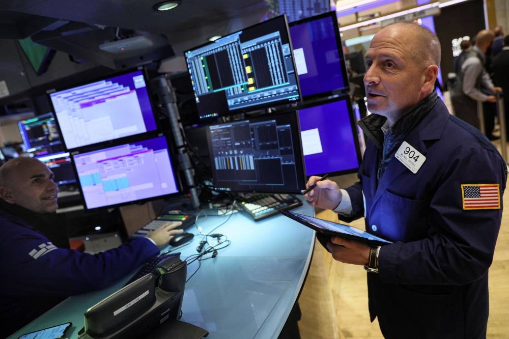 Traders work on the floor of the New York Stock Exchange (NYSE) in New York City November 21, 2022. — Reuters pic