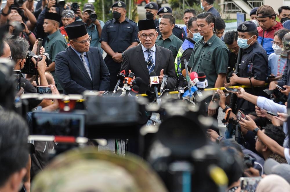 Pakatan Harapan chairman Datuk Seri Anwar Ibrahim speaks during a press conference after meeting with the Yang di-Pertuan Agong at Istana Negara November 22, 2022. — Picture by Miera Zulyana