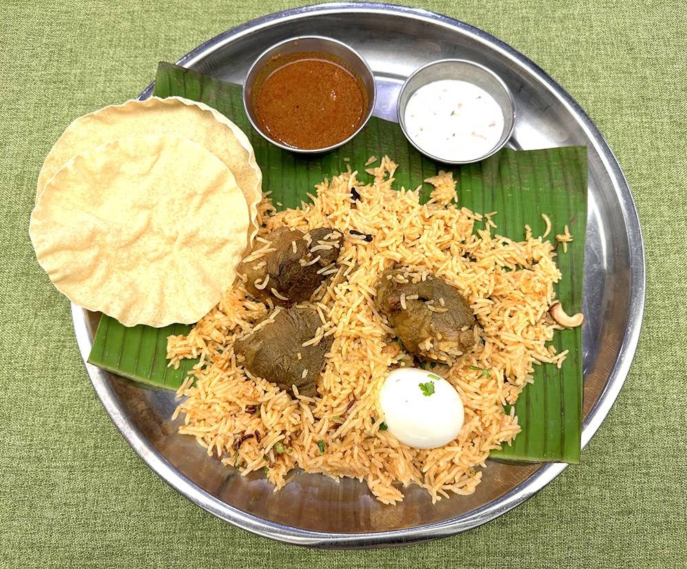 Tender chunks of lamb are paired with fluffy biryani rice... so good that you won't be able to stop eating.