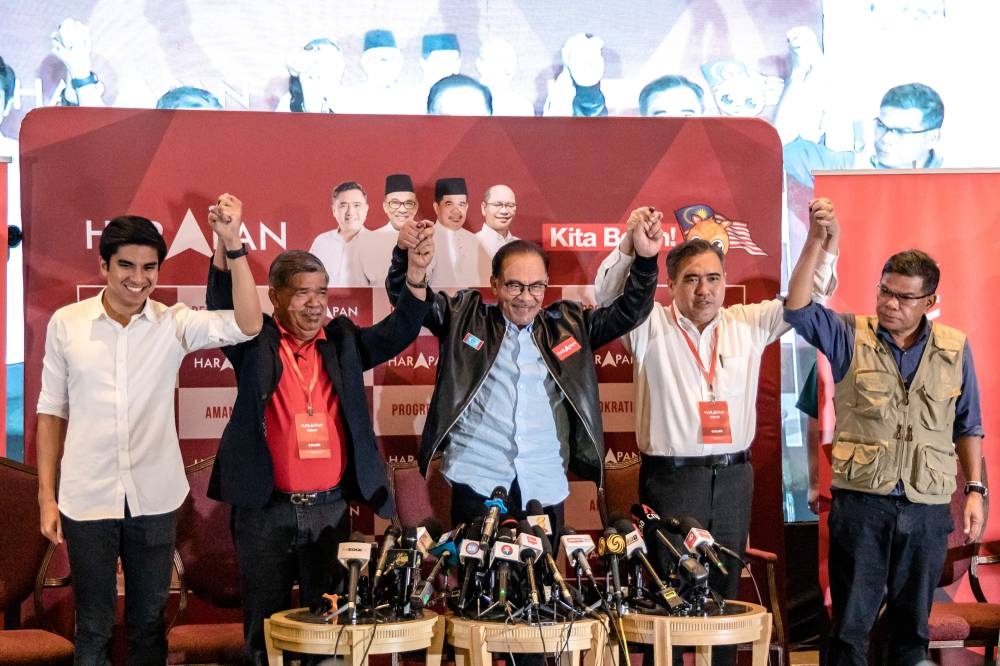 Pakatan Harapan, led by chairman Datuk Seri Anwar Ibrahim (centre), managed to gather 82 out of 222 seats in the 15th geneal election. —  Picture by Firdaus Latif