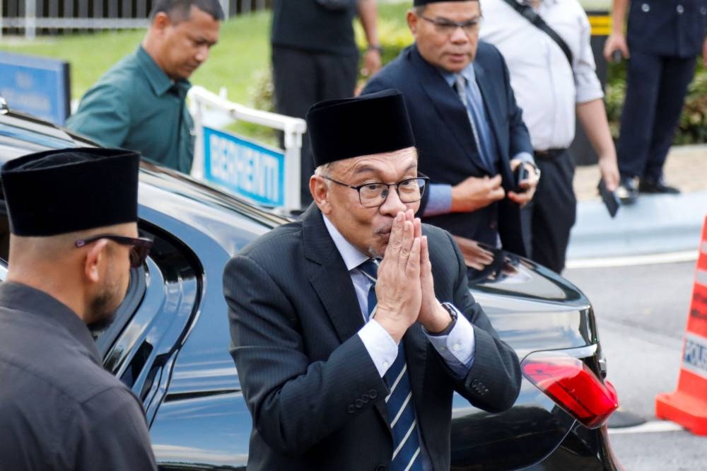 Datuk Seri Anwar Ibrahim gestures as he attends a news conference outside Istana Negara, Kuala Lumpur, Malaysia November 22, 2022. — Reuters pic 