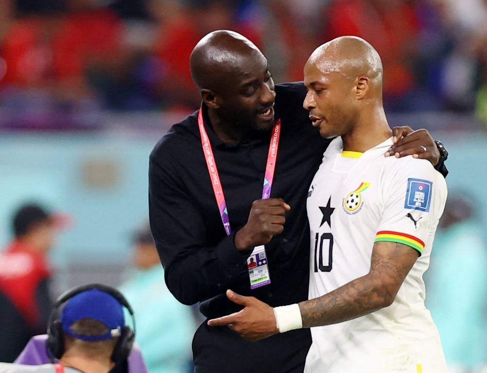 Ghana's Andre Ayew with coach Otto Addo during the match against Portugal November 25, 2022. ― Reuters pic