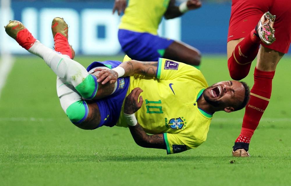 Brazil’s Neymar reacts after a challenge from Serbia’s Sasa Lukic at Lusail Stadium, Lusail, Qatar, November 24, 2022. — Reuters pic 