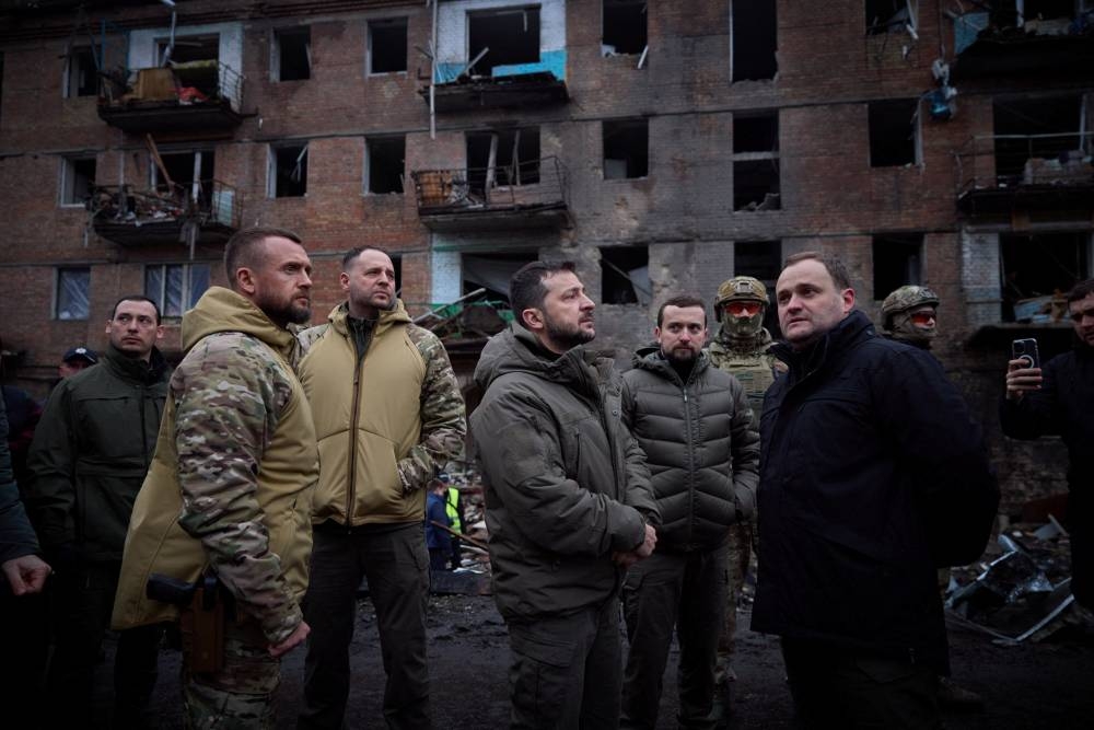 Ukraine's President Volodymyr Zelensky visits a site of a residential building destroyed by a Russian missile attack, as Russia's attack on Ukraine continues, in the town of Vyshhorod, near Kyiv, Ukraine November 25, 2022. ― Ukrainian Presidential Press Service/Handout via Reuters