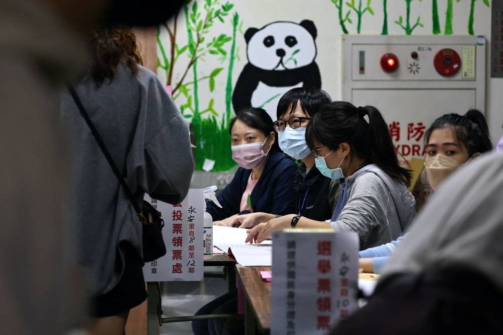 People line up to cast their votes on election day in Taipei, Taiwan, November 26, 2022. ― Reuters pic