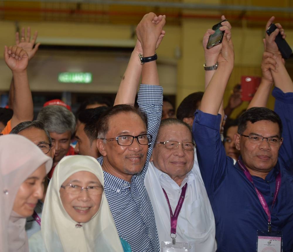 File picture shows DAP veteran leader Lim Kit Siang with Datuk Seri Anwar Ibrahim and Wan Azizah after Anwar won the Port Dickson by-election, October 13, 2018. — Malay Mail pic