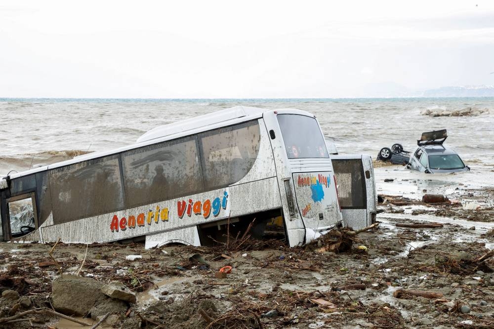 Damaged cars are seen by the sea, following a landslide on the Italian holiday island of Ischia, Italy November 26, 2022. ― Reuters pic