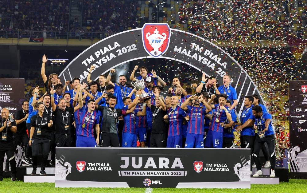 The JDT team celebrate their success after defeating Selangor FC 2-1 in the final of the Malaysia Cup 2022 at Stadium Bukit Jalil November 26, 2022. — Bernama pic