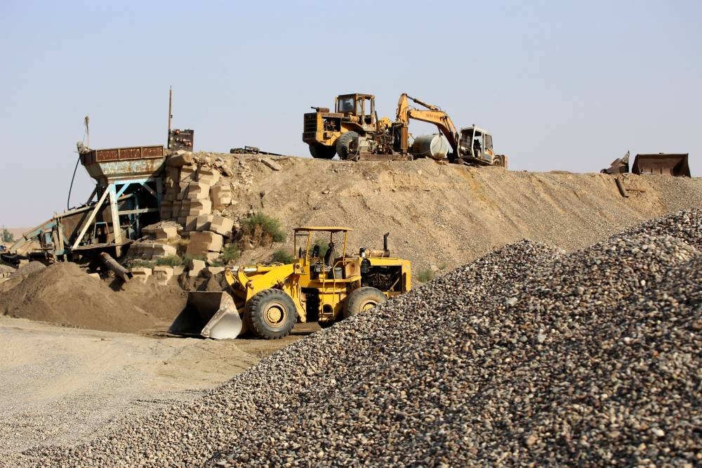 Construction vehicles operate on the site of Makhoul dam project on the Tigris river, near the village of Messahag in northern Iraq's Salaheddine province, on November 1, 2022. — AFP pic