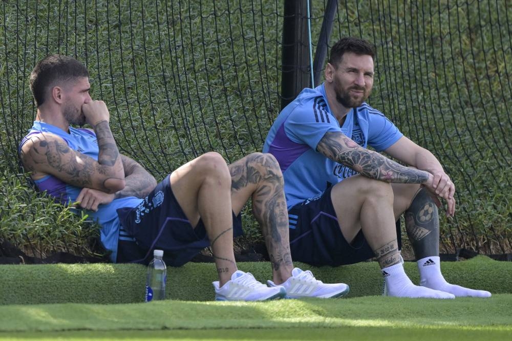 Argentina forward Lionel Messi (right) duringa training session at Qatar University in Doha November 27, 2022. — Reuters pic