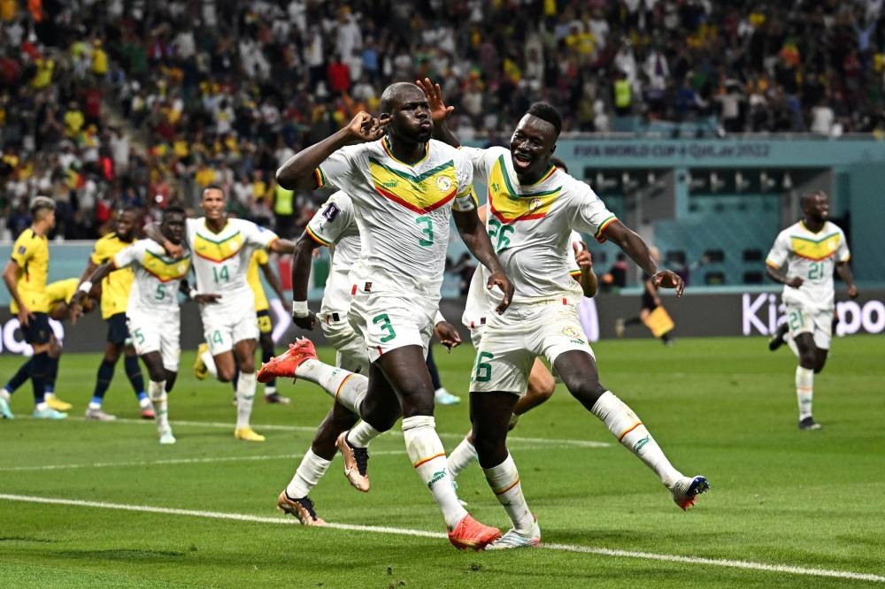 Senegal's Kalidou Koulibaly celebrates scoring their second goal against Ecuador with teammates at the Khalifa International Stadium, Doha November 29, 2022. — Reuters pic  