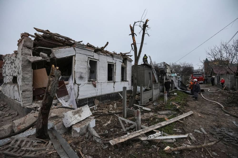 Rescuers work at a site of private houses heavily damaged by a Russian missile strike, amid Russia's attack on Ukraine, in Dnipro, Ukraine November 26, 2022. — Reuters pic