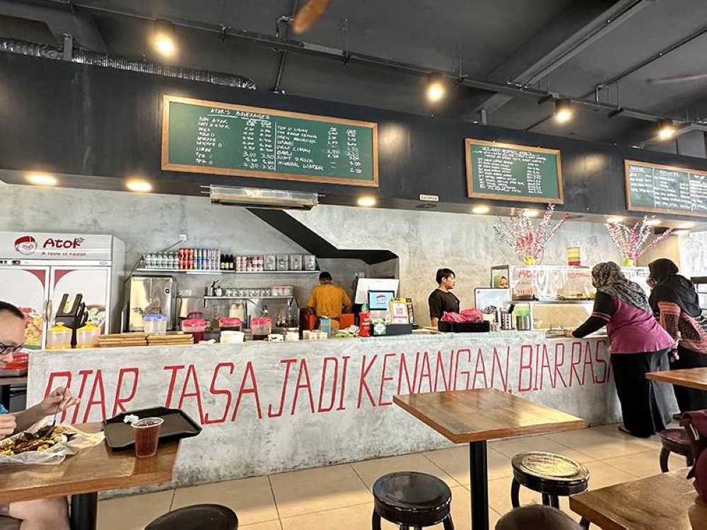 The place features a mural paying tribute to Kedah's paddy fields and a modern look for the food counter.