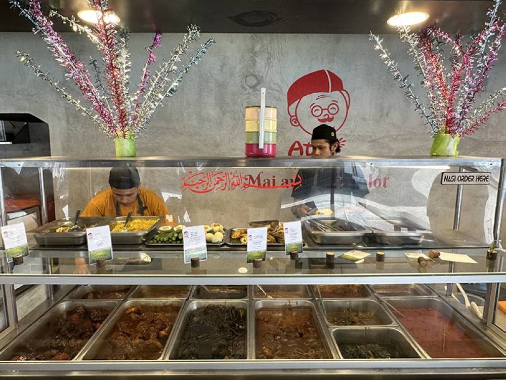 'Bunga mangga' decorate the food counter to signify they're offering 'nasi kenduri'.