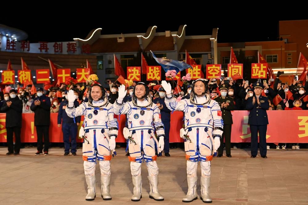Astronauts Fei Junlong, Deng Qingming and Zhang Lu attend a see-off ceremony before the Shenzhou-15 spaceflight mission to build China's space station, at Jiuquan Satellite Launch Center, near Jiuquan, Gansu province, China September 29, 2022.  — Picture by cnsphoto via Reuters