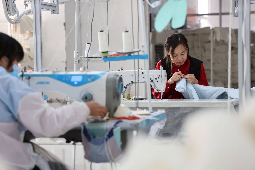 China's Nov factory, services activities fall to seven-month lows on ...