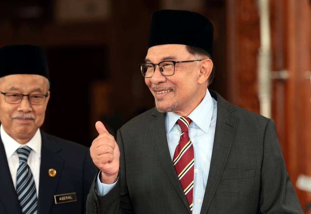 Prime Minister Datuk Seri Anwar Ibrahim gives a thumbs-up sign after attending the Conference of Rulers meeting at Istana Negara, November 30, 2022. — Bernama pic 