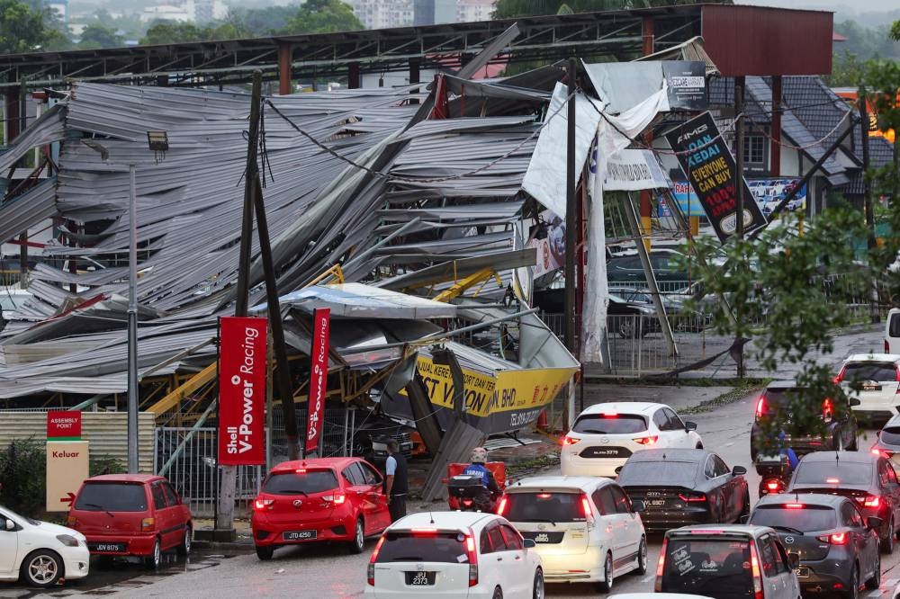 The collapsed roof of a used car lot pictured along Jalan Skudai Kampung Pasir after a freak storm hit Johor Baru, November 30, 2022. — Bernama pic 